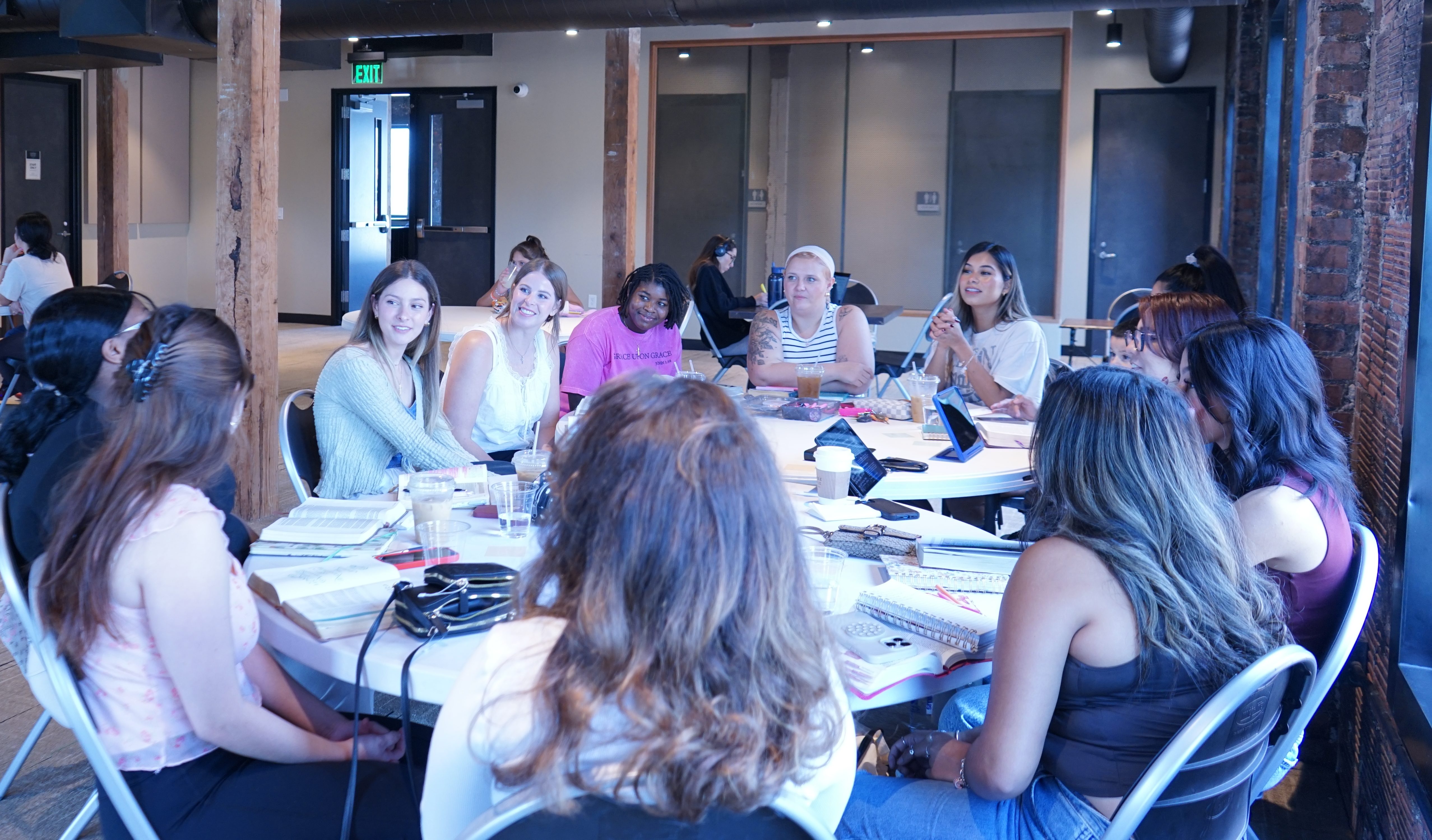 girls sitting around a table for bible study